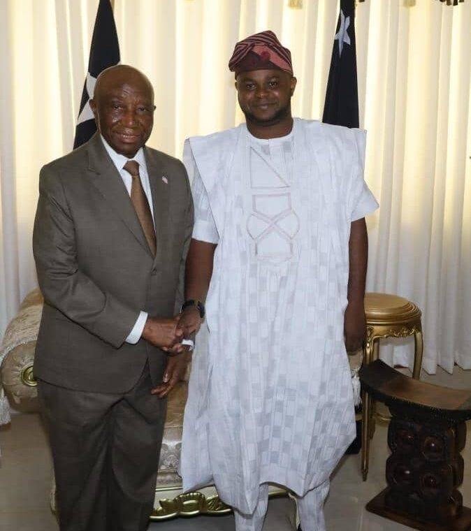 President, Republic of Liberia, President Joseph Boakai in a warm handshake with the Executive Adviser, Presidential Special Envoy on Investment Republic of Liberia, Amb. Tosin Sanusi